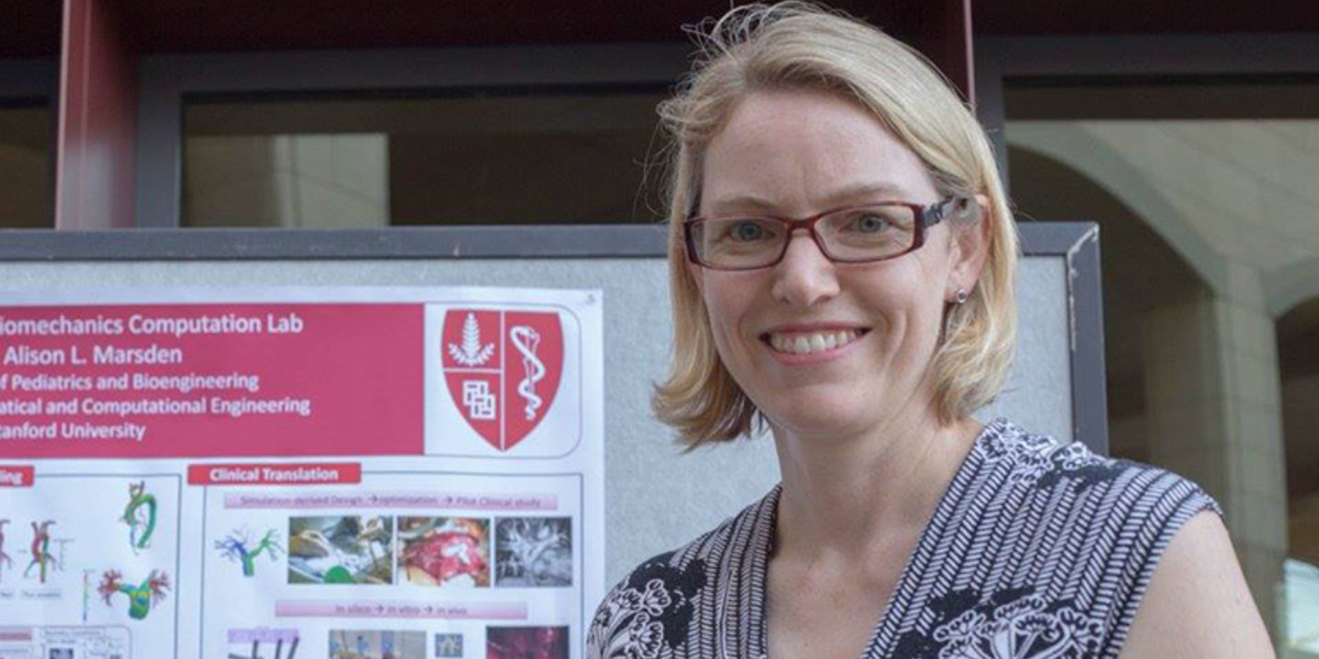 Alison Marsden next to a research poster