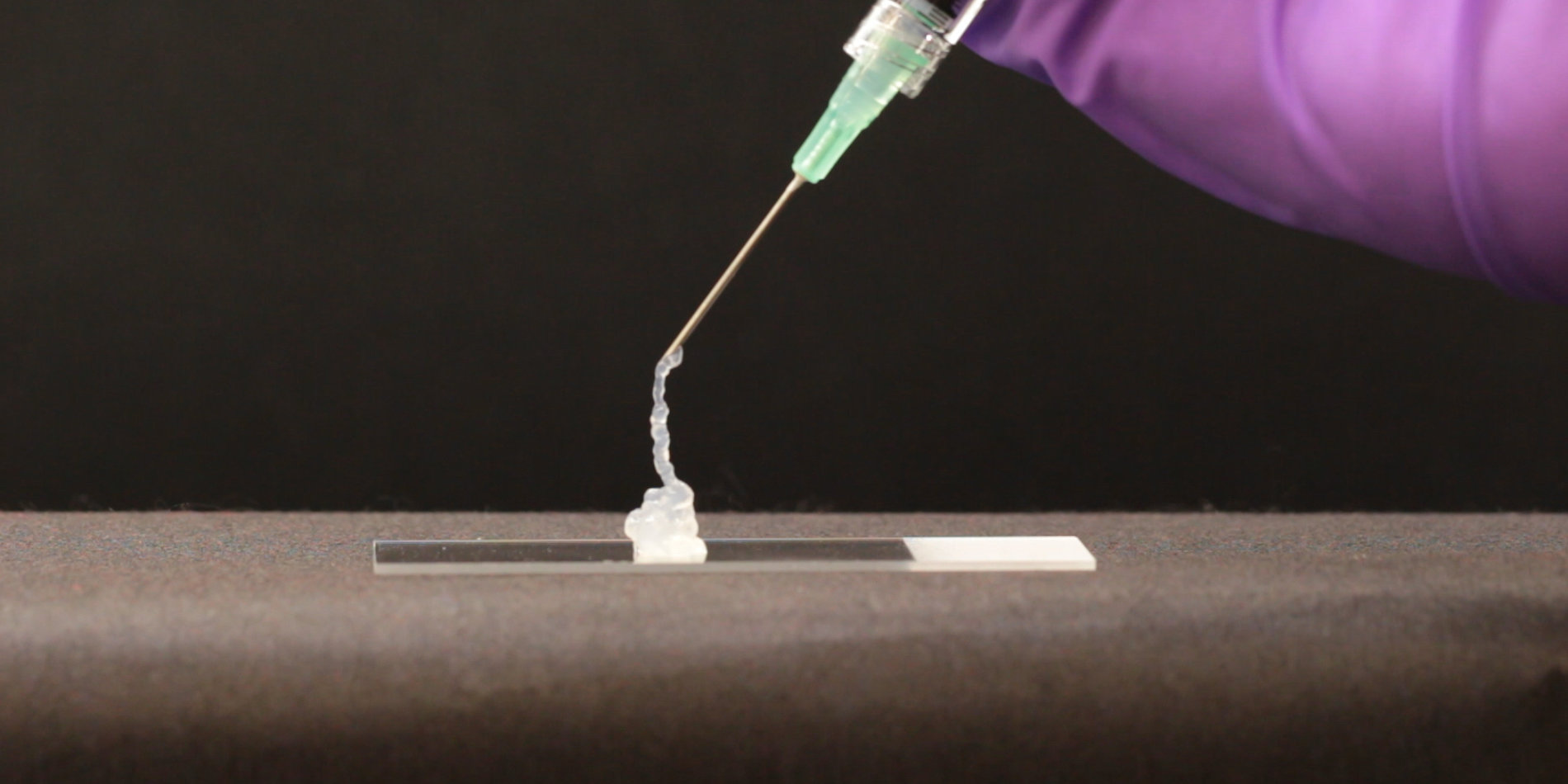 An image of a needle pushing out a hydrogel