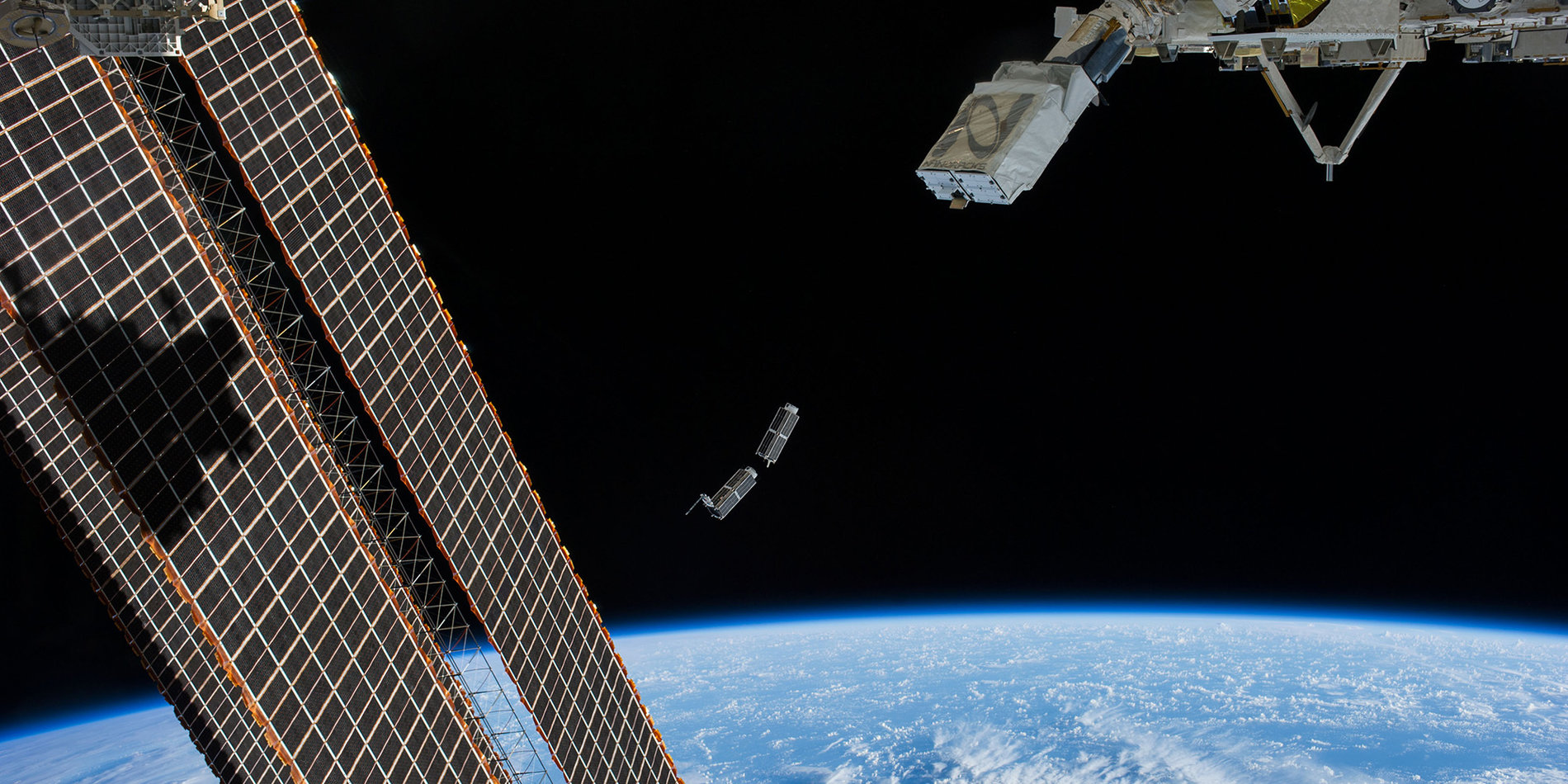 Photo of a set of CubeSats being deployed into space.