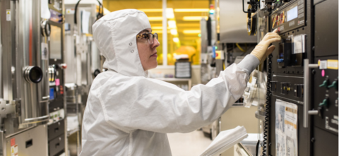 Student in lab in bunny suit