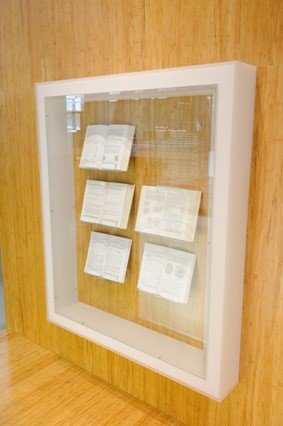The Art of Computer Programming book in a display case