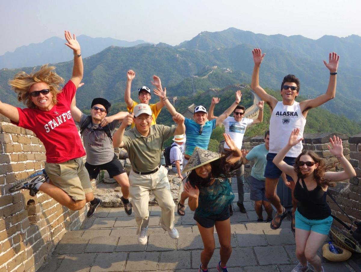 Students jumping up on the Great Wall of China